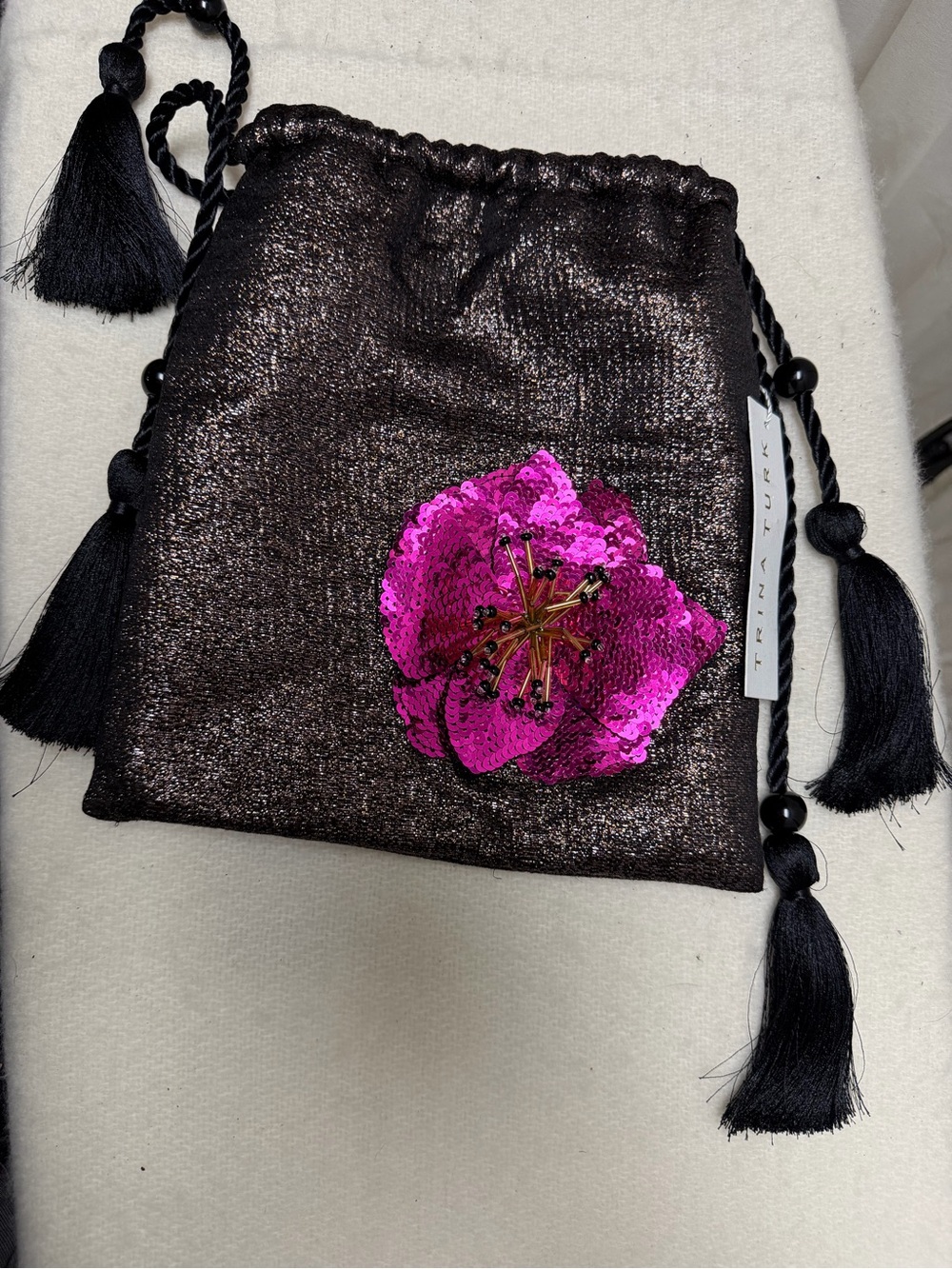 Trina Turk Metallic Black Drawstring Clutch with Pink Sequin Flower